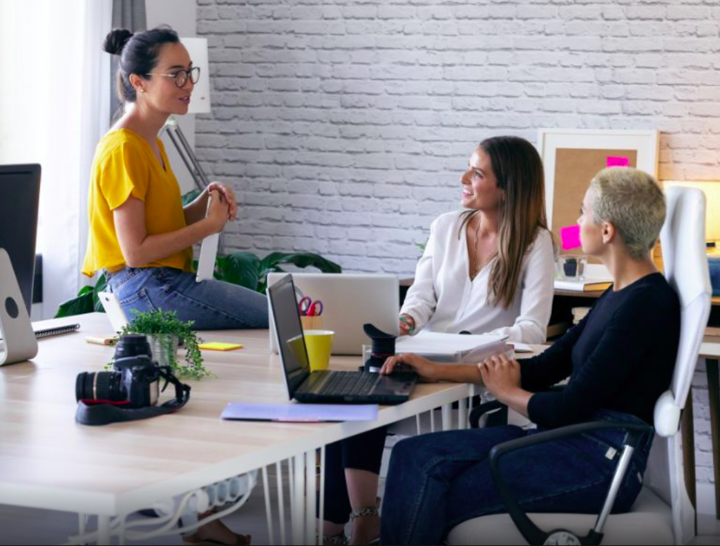 Female founders talking in an office